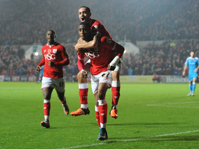 Jonathan Kodjia of Bristol City celebrates his sides goal with Derrick Williams of Bristol City on his shoulders during the Sky Bet Championship match between Bristol City and Wolverhampton Wanderers at Ashton Gate on November 3, 2015