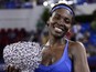 Venus Williams of the US poses with her trophy after winning the women's singles final match against Karolina Pliskova of the Czech Republic at the WTA Elite Trophy in Zhuhai, southern China's Guangdong province on November 8, 2015.
