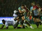 Dave Ward of Harlequins is tackled by Robins Tchake Watchou of Montpellier during the European Rugby Challenge Cup pool 3 match between Harlequins and Montpellier at Twickenham Stoop on November 12, 2015 in London, England.