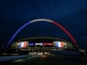 The Wembley arch is illuminated with the French tricolore on November 16, 2015 ahead of the international friendly between England and France