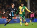 Martin Olsson of Norwich City is chased by Hector Bellerin of Arsenal during the Barclays Premier League match between Norwich City and Arsenal at Carrow Road on November 29, 2015 in Norwich, England. 