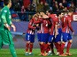 Atletico Madrid's players congratulate teammate French forward Antoine Griezmann (L) after scoring a second goal during the UEFA Champions League Group C football match Club Atletico de Madrid vs Galatasaray AS at the Vicente Calderon stadium in Madrid on