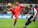 Jordon Ibe of Liverpool takes on Paul Dummett of Newcastle United during the Barclays Premier League match between Newcastle United and Liverpool at St James' Park on December 6, 2015 in Newcastle upon Tyne, England