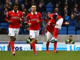 Charlton's Ademola Lookman celebrates with team Reza Ghoochannejhad after scoring the teams first goal during the Sky Bet Championship match between Brighton and Hove Albion and Charlton Athletic at The Amex Stadium on December 05, 2015
