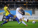 Denis Cheryshev of Real Madrid shoots past Cristian Marquez of Cadiz to score his team's opening goal during the Copa del Rey Round of 32 First Leg match between Cadiz and Real Madrid at Ramon de Carranza stadium on December 2, 2015 in Cadiz, Spain