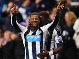 Georginio Wijnaldum of Newcastle United (L) celebrates with Moussa Sissoko as he scores their second goal during the Barclays Premier League match between Newcastle United and Liverpool at St James' Park on December 6, 2015