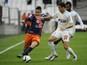 Montpelliers French forward Ryad Boudebouz (L) vies with Marseille's Spanish defender Javier Manquillo during the French L1 football match Olympique de Marseille against Montpellier on December 6, 2015 at Velodrome Stadium in Marseille, southern France.