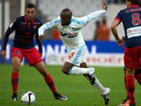 Marseille's French midfielder Lassana Diarra (C) vies with Ajaccio's Tunisian midfielder Mohamed Larbi (L) during the French L1 football match between Olympique de Marseille (OM) and Gazelec-Ajaccio on December 13, 2015 at the Velodrome stadium in Marseil