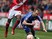 Albert Adomah of Middlesbrough fouls Luke Varney of Ipswich Town during the Sky Bet Championship match between Middlesbrough and Ipswich Town at the Riverside Stadium on March 14, 2015