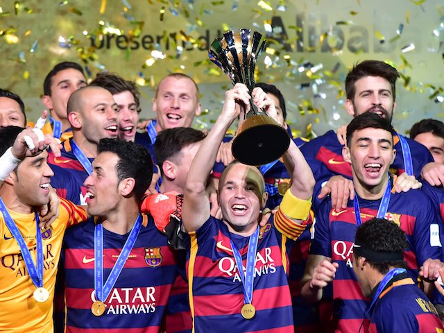 Barcelona captain Andres Iniesta raises the Club World Cup trophy on December 20, 2015