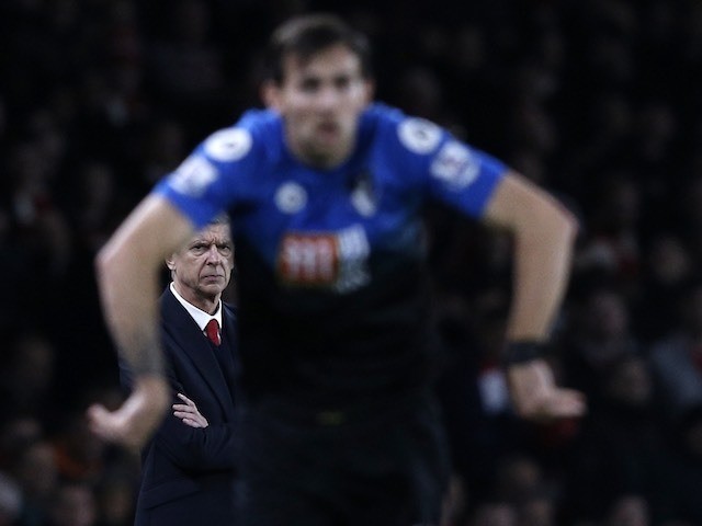 Arsene Wenger watches on intently during the game between Arsenal and Bournemouth on December 28, 2015