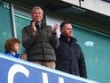 Chelsea owner Roman Abramovich applauds from the stand the FA Cup third-round match against Scunthorpe United at Stamford Bridge on January 10, 2016