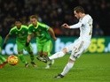 Gylfi Sigurdsson of Swansea City converts the penalty to score his team's first goal against Sunderland at the Liberty Stadium on January 13, 2016