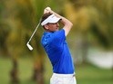  Ian Poulter of team Europe plays a shot during the first day's fourball matches at the EurAsia Cup on January 15, 2016 in Kuala Lumpur, Malaysia
