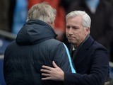 Alan Pardew embraces Manuel Pellegrini prior to the game between Man City and Crystal Palace on January 16, 2016