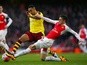 Andre Gray and Gabriel compete for the ball during FA Cup fourth-round match between Burnley and Arsenal on January 30, 2016
