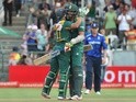 South African batsmen AB de Villiers and David Wiese congratulate each other on scoring the final run to win the final ODI against England on February 14, 2016