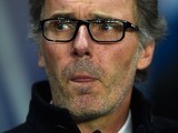Laurent Blanc licks his lower lip as he observes the on-the-field action during the Champions League encounter between Paris Saint-Germain and Chelsea on February 16, 2016