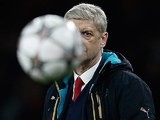 Arsene Wenger plays hard to get during the Champions League game between Arsenal and Barcelona on February 22, 2016