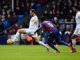 Jordan Henderson evades Wilfried Zaha during the Premier League game between Crystal Palace and Liverpool on March 6, 2016