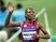 Abeba Aregawi of Sweden waves after crossing the finishing line during the women's 1,500m of the Diamond League Track and Field competition on May 18, 2014