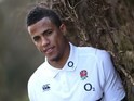 Anthony Watson poses with a tree at an England photocall on March 7, 2016
