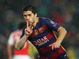 Luis Suarez asks for quiet after scoring during the Champions League round-of-16 second leg between Barcelona and Arsenal on March 16, 2016