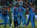 Assorted Indians celebrate the wicket that led to the victory of India by two runs during the World T20 in Bangalore on March 23, 2016