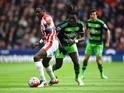 Giannelli Imbula and Bafetimbi Gomis in action during the Premier League match between Stoke City and Swansea City on April 2, 2016