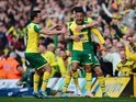 Martin Olsson celebrates with his Norwich City teammates after scoring the winning goal against Newcastle United on April 2, 2016
