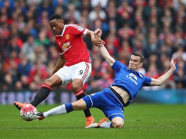 Anthony Martial and Seamus Coleman in action during the Premier League match between Manchester United and Everton on April 3, 2016