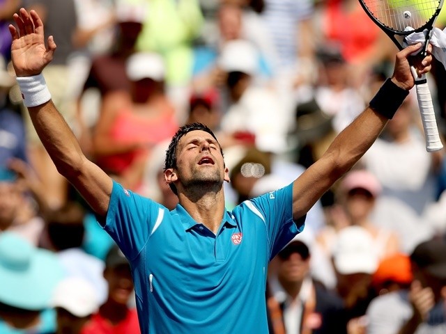 Novak Djokovic celebrates his win over David Goffin during the semi-finals of the Miami Open on April 1, 2016