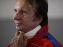 Former F1 driver Emerson Fittipaldi before taking part in a parade to mark the race's 50th anniversary ahead of this year's British Formula One Grand Prix at Silverstone Circuit on July 4, 2014