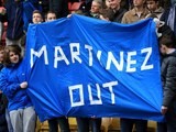 Supporters protest against Roberto Martinez during the Premier League game between Watford and Everton on April 9, 2016