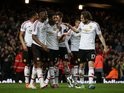 Marcus Rashford celebrates scoring the opener with teammates during the FA Cup replay between West Ham United and Manchester United on April 13, 2016
