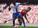 Pape Souare and Alexis Sanchez vie for the ball during the Premier League game between Arsenal and Crystal Palace on April 17, 2016