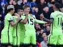 City players celebrate Sergio Aguero's opener during the Premier League game between Chelsea and Manchester City on April 16, 2016