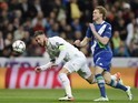 Sergio Ramos attempts to fend off Andre Schurrle during the Champions League quarter-final between Real Madrid and Wolfsburg on April 12, 2016