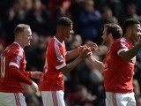 Marcus Rashford is congratulated by Juan Mata after scoring during the Premier League game between Manchester United and Aston Villa on April 16, 2016