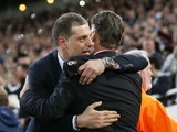 Slaven Bilic embraces Louis van Gaal prior to the FA Cup replay between West Ham United and Manchester United on April 13, 2016
