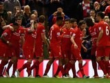 Philippe Coutinho celebrates with teammates after scoring the fourth during the Premier League game between Liverpool and Everton on April 20, 2016