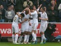 Andre Ayew celebrates scoring the opener during the Premier League game between Swansea City and Liverpool on May 1, 2016