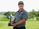 Charley Hoffman poses with the Valero Texas Open trophy during the final round of the Valero Texas Open at TPC San Antonio AT&T Oaks Course on April 24, 2016