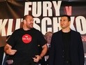 Tyson Fury dances alongside Wladimir Klitschko during their head-to-head press conference at Manchester Arena on April 27, 2016