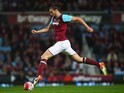Andy 'The Gazelle' Carroll leaps forward during the Premier League game between West Ham United and Manchester United on May 10, 2016