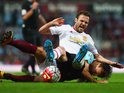 Juan Mata and Mark Noble in a tussle during the Premier League game between West Ham United and Manchester United on May 10, 2016