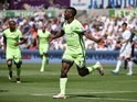 Kelechi Iheanacho celebrates scoring during the Premier League game between Swansea City and Manchester City on May 15, 2016