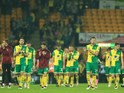 Norwich City players look distraught as they contemplate having to face lowly Ipswich Town and Wolverhampton Wanderers in the Championship next season following their relegation from the Premier League