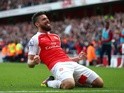 Olivier Giroud celebrates scoring during the Premier League game between Arsenal and Aston Villa on May 15, 2016