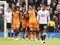 Tom Ince looks downbeat as Hull players celebrate their second goal during the Championship playoff semi-final between Derby County and Hull City on May 14, 2016